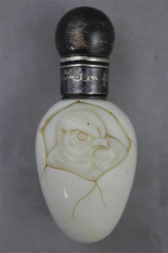 A Stourbridge milk glass chick and egg scent bottle, possibly Stevens & Williams, late 19th century, 8.5cm